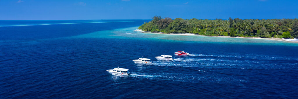 Arriva speedboat making a sharp turn, showcasing the high-speed and dynamic speedboat transfer services in the Maldives.