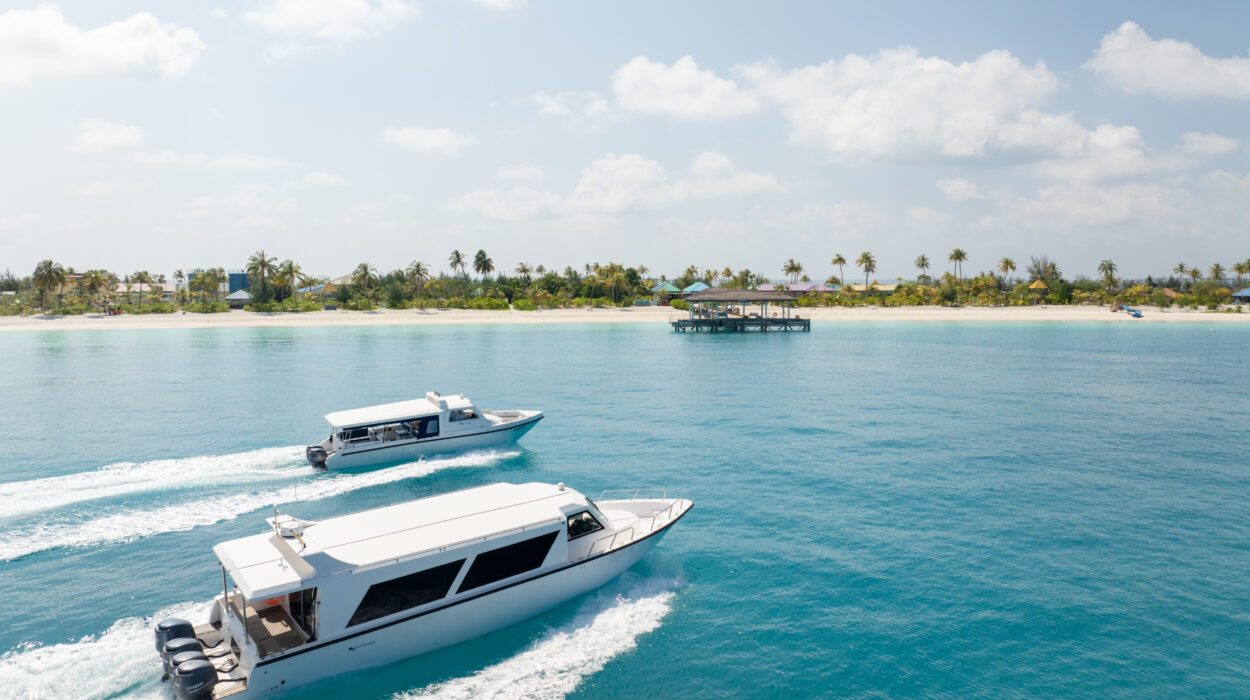 Private speed boat transfers approaching a beautiful Maldives island.